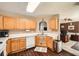 Well-lit kitchen features wood cabinets, white countertops, and modern appliances at 181 Weatherstone Dr, Woodstock, GA 30188