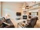Comfortable living room with fireplace, plush furniture, and ample natural light at 181 Weatherstone Dr, Woodstock, GA 30188