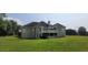 Stunning home exterior with lush lawn, screened in patio, and spacious balcony at 5690 Rutland Trce, Lithonia, GA 30058
