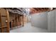Unfinished basement showing framing, duct work, and concrete walls at 5690 Rutland Trce, Lithonia, GA 30058