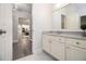 Bathroom features a view of the home and a marble sink at 5690 Rutland Trce, Lithonia, GA 30058