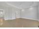 Spacious bedroom with light hardwood floors, tray ceilings and neutral paint at 5690 Rutland Trce, Lithonia, GA 30058