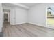Bright bedroom features wood floors and a window letting in natural light at 5690 Rutland Trce, Lithonia, GA 30058
