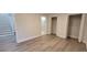 Bedroom with walk-in closet and bath access; neutral walls and floors at 5690 Rutland Trce, Lithonia, GA 30058
