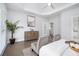 A light and bright main bedroom with hardwood floors and neutral walls for a calm, relaxing atmosphere at 5690 Rutland Trce, Lithonia, GA 30058