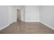 Clean and bright bedroom with neutral walls and flooring, featuring multiple closets for ample storage space at 5690 Rutland Trce, Lithonia, GA 30058