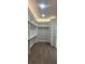 Walk-in closet with ample shelving and hanging space for organized storage at 5690 Rutland Trce, Lithonia, GA 30058