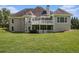 Back exterior of house features a two-story deck and screened porch at 5690 Rutland Trce, Lithonia, GA 30058