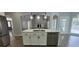 Open kitchen with a center island, stainless steel appliances, seamlessly connecting to the living area at 5690 Rutland Trce, Lithonia, GA 30058