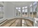Bright office space featuring several windows that bring in natural light and hardwood floors at 5690 Rutland Trce, Lithonia, GA 30058