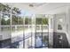 Bright sunroom with marble flooring and glass enclosure at 5690 Rutland Trce, Lithonia, GA 30058