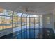 Relaxing sunroom with lake views, ceiling fan, tile flooring and lots of windows at 5690 Rutland Trce, Lithonia, GA 30058