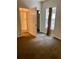 Bedroom with carpet, a window, and an ensuite bathroom featuring a glass-door shower at 1428 Orchard Park Dr, Stone Mountain, GA 30083