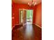 Dining room with chandelier, French doors leading to the outdoor porch area at 1428 Orchard Park Dr, Stone Mountain, GA 30083