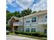Inviting exterior featuring manicured landscaping, private balconies, and assigned parking spaces at 1428 Orchard Park Dr, Stone Mountain, GA 30083