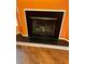 Close-up of a classic fireplace and the beautiful wood-look flooring at 1428 Orchard Park Dr, Stone Mountain, GA 30083