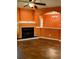 Bright living area with wood flooring, fireplace, and decorative archway at 1428 Orchard Park Dr, Stone Mountain, GA 30083