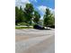 Outdoor view of a condominium with landscaping and parking lot with plenty of parking at 1428 Orchard Park Dr, Stone Mountain, GA 30083
