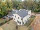 Aerial view of the rear of the home showing a large yard, patio, and architectural details at 2312 Herring Sw Rd, Atlanta, GA 30311