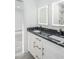 Bathroom featuring a double sink vanity with marble counters, and gold hardware at 2312 Herring Sw Rd, Atlanta, GA 30311