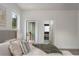 Bedroom featuring a doorway to an outdoor patio and an en suite bathroom at 2312 Herring Sw Rd, Atlanta, GA 30311