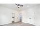 Light gray flooring, white walls, and double closet doors in this bedroom near other doorways at 2312 Herring Sw Rd, Atlanta, GA 30311