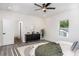 Bright bedroom featuring a modern rug, a ceiling fan, and lots of natural light at 2312 Herring Sw Rd, Atlanta, GA 30311