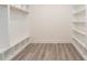Spacious walk-in closet with custom shelves and closet rods offers plenty of space to organize belongings at 2312 Herring Sw Rd, Atlanta, GA 30311