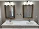 Stylish bathroom featuring a marble countertop, double sinks and updated fixtures at 2625 Semmes St, Atlanta, GA 30344