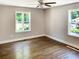 Bedroom with hardwood floors, neutral walls, and natural light from two windows at 2625 Semmes St, Atlanta, GA 30344