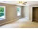 Bedroom with carpet flooring, light walls, two windows, and a closet at 2625 Semmes St, Atlanta, GA 30344