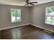 Bright bedroom with hardwood floors and natural light from two windows at 2625 Semmes St, Atlanta, GA 30344
