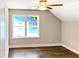 Cozy bedroom featuring hardwood floors, light walls, and a view from the window at 2625 Semmes St, Atlanta, GA 30344