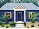 Charming blue home with a welcoming front door, white columns and light wood accents at 2625 Semmes St, Atlanta, GA 30344