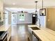 Open-concept kitchen featuring a marble island connecting to the living area with hardwood floors at 2625 Semmes St, Atlanta, GA 30344