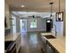 Open concept view from the kitchen to the living room with hardwood floors and modern design at 2625 Semmes St, Atlanta, GA 30344
