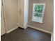 Mud room featuring gray tiled floor, white trim, and storage at 2625 Semmes St, Atlanta, GA 30344