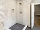 Bathroom shower featuring subway tile walls and a mosaic tile floor at 2625 Semmes St, Atlanta, GA 30344