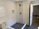 Modern shower with white subway tile and a herringbone accent wall at 2625 Semmes St, Atlanta, GA 30344