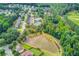 Community with a swimming pool, tennis courts, pond, and lush greenery surrounding the homes at 4092 Duran Ln, Auburn, GA 30011
