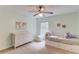 Bedroom with bright walls, carpet, natural light, a ceiling fan, and a double bed is comforting and functional at 4092 Duran Ln, Auburn, GA 30011