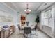 Elegant dining room with light blue walls, white trim, modern chandelier, and stylish decor at 4092 Duran Ln, Auburn, GA 30011