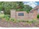 Mineral Springs Crossing entrance with stone monument sign and manicured landscaping at 4092 Duran Ln, Auburn, GA 30011