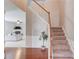 Open foyer with hardwood floors, staircase, and a view of the living room at 4092 Duran Ln, Auburn, GA 30011