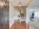 An inviting foyer with gleaming hardwood floors, staircase, and an elegant pendant light at 4092 Duran Ln, Auburn, GA 30011