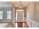 Bright foyer with hardwood floors, a white front door, and elegant trim, creating a welcoming entrance at 4092 Duran Ln, Auburn, GA 30011