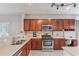 Well-equipped kitchen boasts stainless steel appliances and counter space at 4092 Duran Ln, Auburn, GA 30011