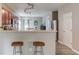 Kitchen view featuring breakfast bar with seating and stainless steel appliances at 4092 Duran Ln, Auburn, GA 30011
