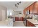 Open kitchen design with stainless steel appliances and breakfast bar at 4092 Duran Ln, Auburn, GA 30011