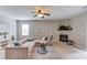 Spacious living room with a fireplace and a large sectional sofa at 4092 Duran Ln, Auburn, GA 30011
